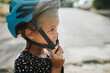 © Johnér - Close-up of girl wearing bicycle helmet