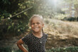 © Johnér - Happy girl with braided hair standing outdoors