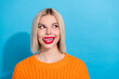 Portrait of pretty woman with bob hairstyle dressed knitwear sweater tongue lick teeth look empty space isolated on blue color background