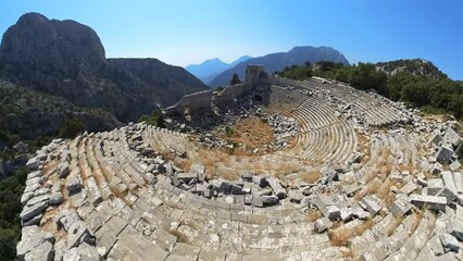 Wall Mural - ancient theater of Turkey in the stunning natural landscapes of Mount Gulluk-Termessos National Park. Well-preserved ruins with seating rows and the theater's exceptional acoustics