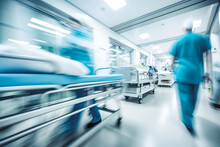 Hospital Emergency Team Rush Patient On Gurney To The Operation Room. Patient Being Rushed Into Operating Room In Hospital By A Group Of Doctors. Motion Blur Moving