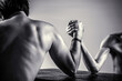 © Yevhen - Arms wrestling thin hand, big strong arm. Two man's hands clasped arm wrestling, strong and weak, unequal match. Black and white