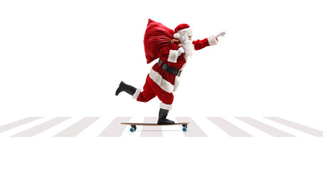 Wall Mural - Full length profile shot of Santa Claus riding a longboard at a pedestrian crossing