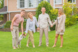 © T.Den_Team - Portrait of happy family at home yard, relax at beautiful day, relationship and lifestyle of family values