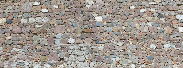 Poster - Typical rustic castle wall in Tuscany, in panoramic format.