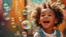 An African American Child Blowing Bubbles And Laughing With Joy Against A Colorful Background