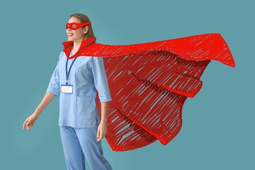 Canvas Print - Female doctor in superhero costume on blue background