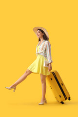 Sticker - Young woman with suitcase on yellow background