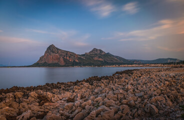 Wall Mural - Sunset on the paradise Tyrrhenian sea bay. San Vito lo Capo and Monte Monaco in far, Sicily, Italy. June 2023, Long exposure picture