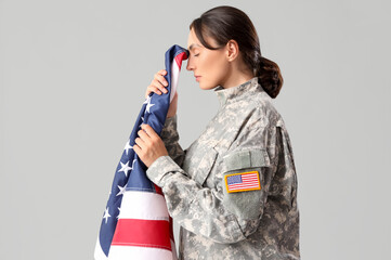 Sticker - Female soldier with USA flag on light background. Veterans Day celebration