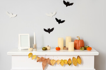 Canvas Print - Halloween pumpkins with candles and frame on fireplace in living room