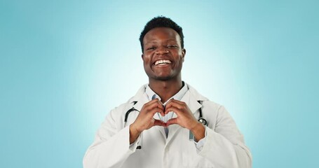 Wall Mural - Man, heart and hands of doctor in studio for healthcare, medical support and kindness on blue background. Portrait of happy african cardiology worker, finger shape and love emoji, icon and thank you