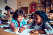 © Marko Geber - Two Young and diverse children working together on assignment in a middle school classroom
