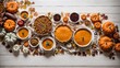 Delicious autumn food table scene Overhead view on white wooden sign background. Stuffed pumpkin and squash, sweet potatoes, appetizers, soups, vegetables, and pumpkin pie.