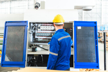 professional technician engineer with safety helmet hard hat working in industrial manufacturing factory, men at work to checking equipment of machinery production technology or construction operating