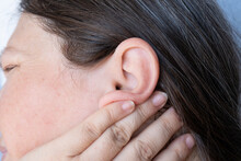 Caucasian Mature Woman Holding Painful Ear Close Up, Hearing Loss, Ear Discomfort, Hearing Test, Women's Health, Acute Otitis Media, Treatment And Care, Diagnosing And Treating, Preventing Ear Issues