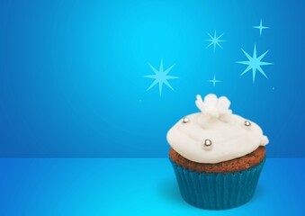 Wall Mural - Tasty sweet birthday cupcake on desk