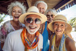 © Ivan Guia - Group of mid adult smiling on vacation looking at camera. Enjoying retirement concept