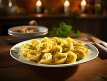 Close Up Of Fresh Cooked Tortellini Ravioli On White Plate, Wooden Table And Dark Blurred Background