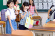© amanaimages - 登校して席に着く小学生たち