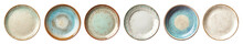 Set of vintage, retro, rustic ceramic empty plates or saucers. Isolated cutout on transparent or white background.