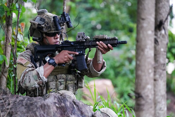 Wall Mural - Military army soldiers tactical team, commando group moving cautiously in forest area, kneeling and looking around, covering comrades, controlling sectors. Commander showing halt or stop hand signal