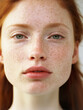 © iconogenic - Portrait of a young natural redhead woman with freckles and a fresh, no-makeup look.