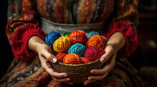 Female Hands Holding A Basket With Balls Of Wool