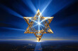 The logo of Judaism against the sky emits rays of light. Hanukkah holiday celebration concept. The Star of David as a symbol of the Jewish religion. Symbol of the religion of Judaism.