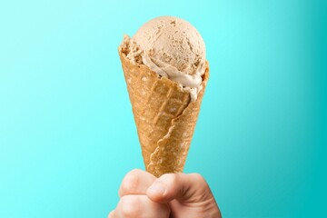 Canvas Print - Sweet Ice cream cone in human hand.