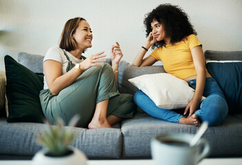 women, friends relax and conversation in a home with gossip, discussion and happy in a living room. 