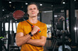 © Quality Stock Arts - Badminton player athlete man with racket in sport studio fitness muscle training background