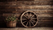 A Vintage Wooden Wagon Wheel Against A Rustic Barn Backdrop