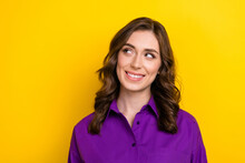 Photo Of Friendly Dreamy Satisfied Woman With Wavy Hairstyle Dressed Purple Shirt Look At Offer Empty Space Isolated On Yellow Background