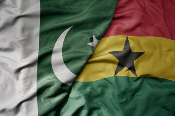 big waving realistic national colorful flag of pakistan and national flag of ghana .