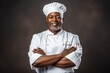 © blvdone - Black African American Chef pausing smiling happy face crossing arms in restaurant