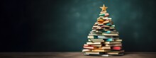 Christmas Tree Made From Pile Of Books. Colorful Books In The Form Of Christmas Tree On Green Background. Creative Chirstmas Background In Minimalist Style. Holiday Book Sale, Christmas Reading.