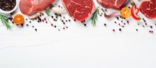 Top view of organic food a banner with raw meat including steak salmon beef and chicken displayed on a white wooden background