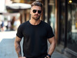 © Pemika - A man with sunglasses wearing blank empty black t-shirt mockup for design template