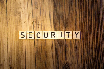 Security concept word in wooden letters on dark wood background