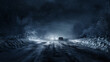 Image of a car's headlights illuminating a treacherous, snowy dirt road at night..