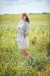 © hiv360 - beautiful girl in a linen dress in a wheat field