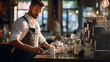 © PaulShlykov - Smiling attractive man barista standing behind the counter at the coffee shop, showing coffee cup
