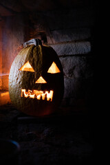 Wall Mural - scary Halloween pumpkin glowing in window at night