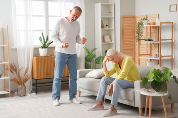 Wall Mural - Mature couple quarreling at home. Divorce concept