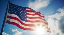 American Flag Waving In Blue Sky
