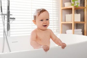 Sticker - Cute little baby bathing in tub at home