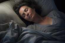 Woman sleeping at home in bed, mature lady relax