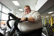 Chubby executive actively engaging in rigorous gym activities 