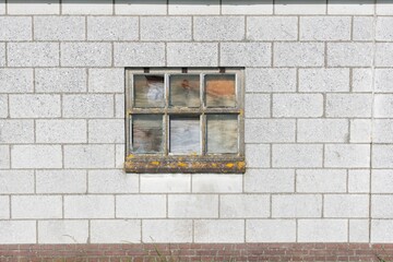 old desolat window on a wall